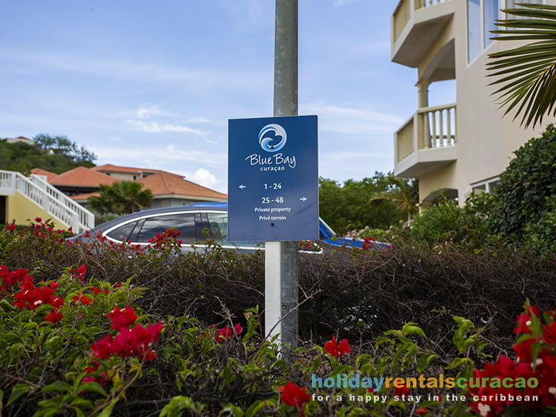 free parking at the entrance of the apartments triple tree blue bay golf and beach resort