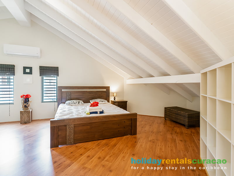Another spacious bedroom with air conditioning